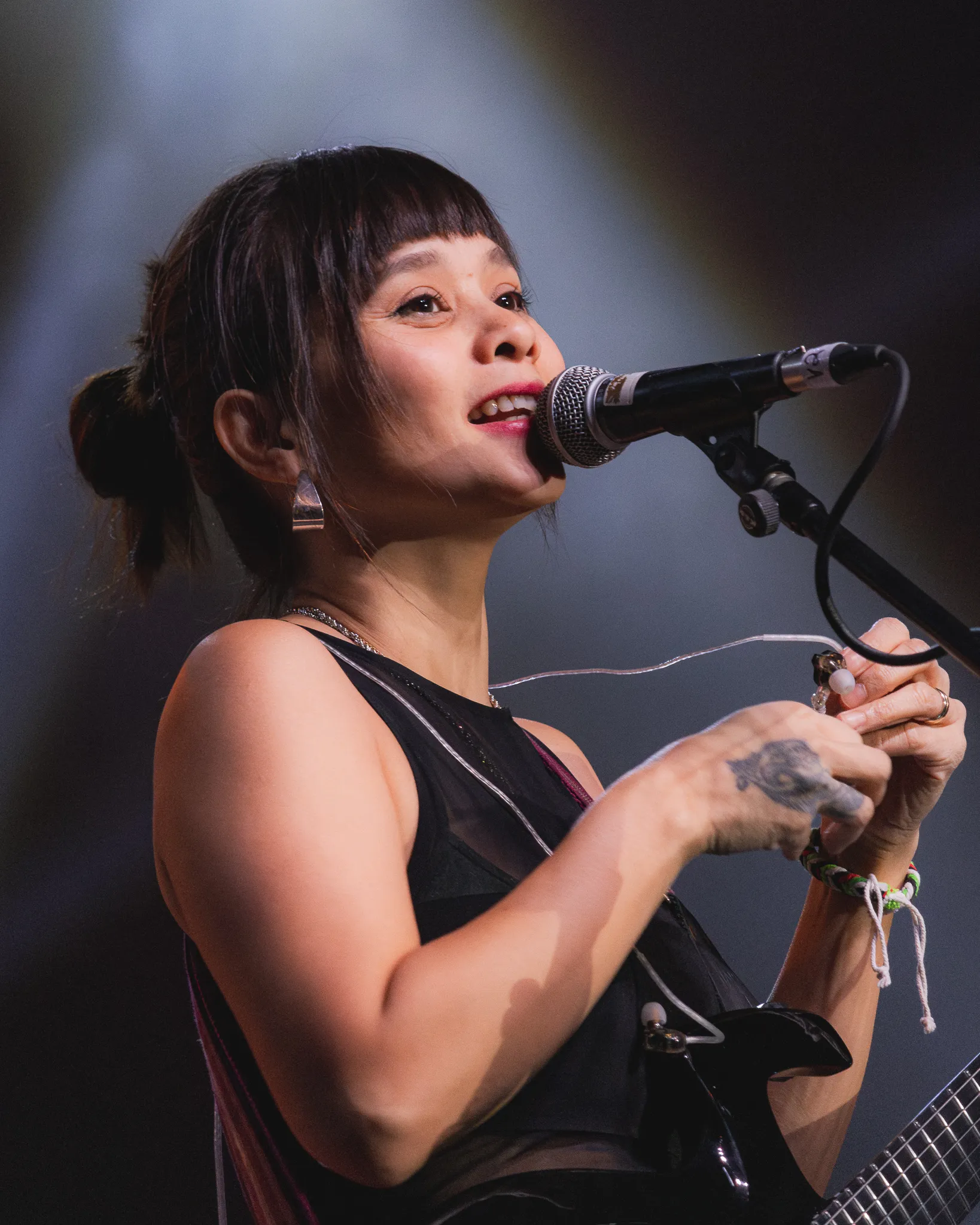 Kitchie Nadal, an original filipino music artist in front of the mic.