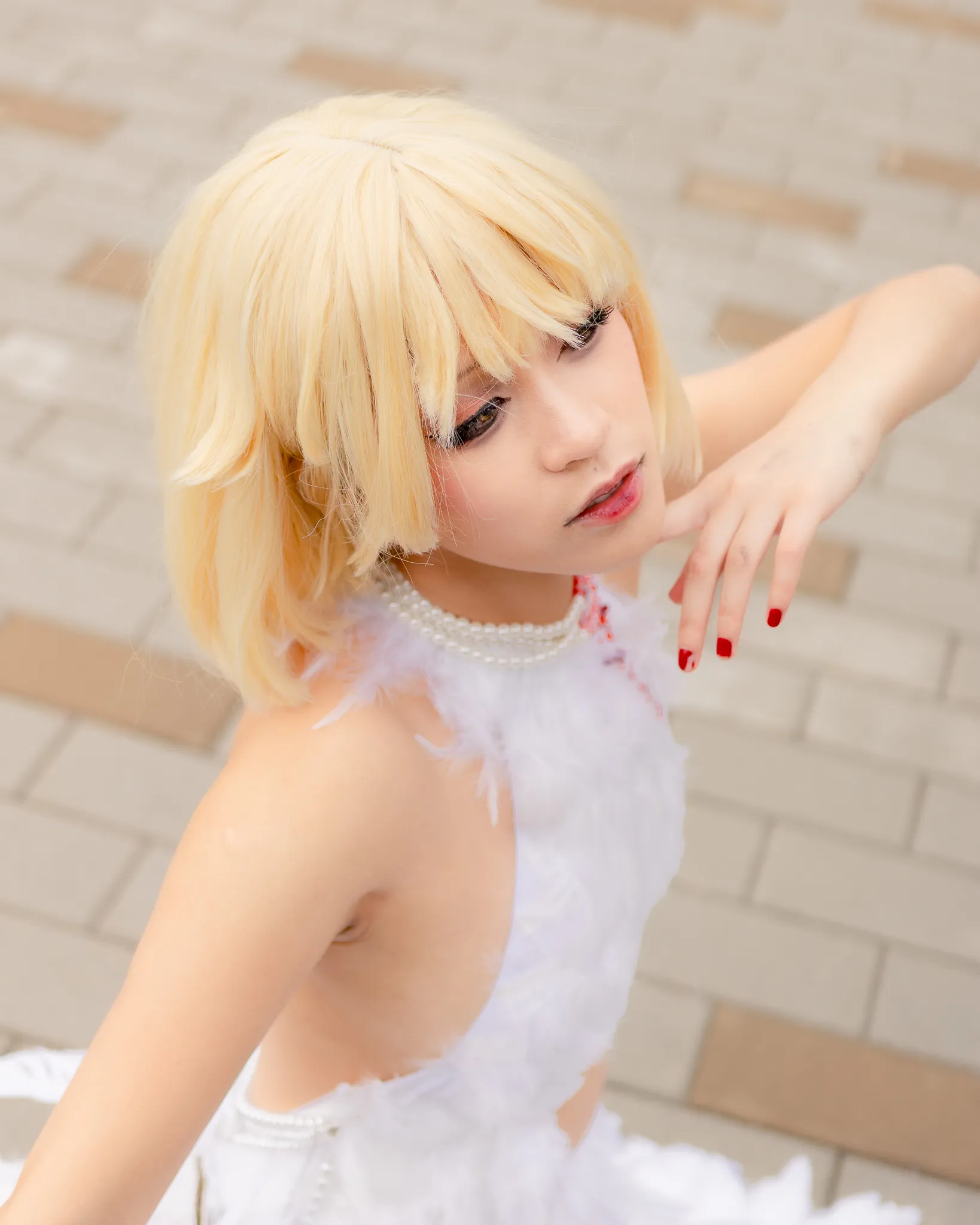 A cosplayer featuring Falin from the anime series dungeon meshi.